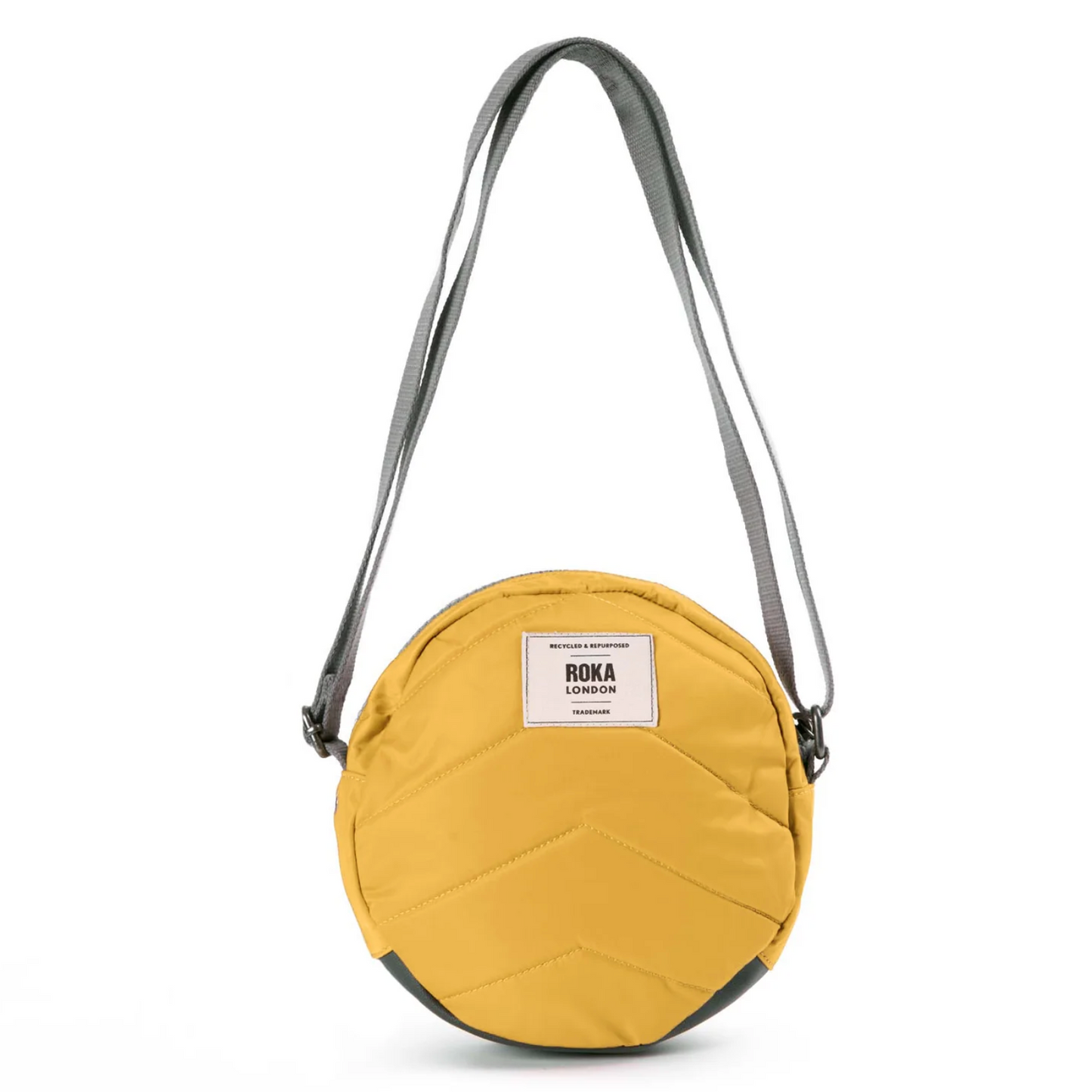 Back view of the crossbody bag with ROKA brand label.