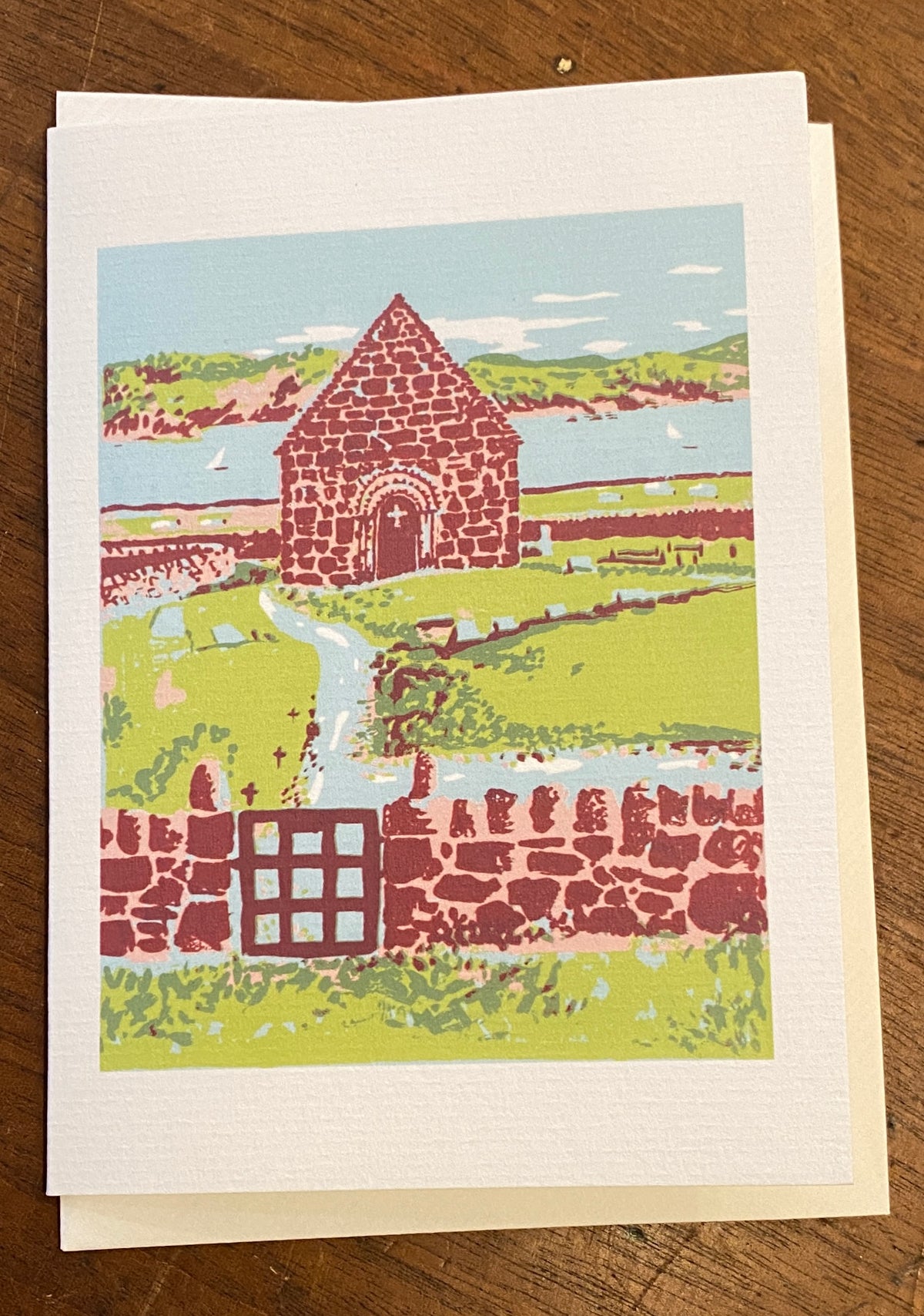 A gift card featuring colourful artwork of Reilig Òdhrain (St Oran’s Graveyard) on Iona by Louise Millar.