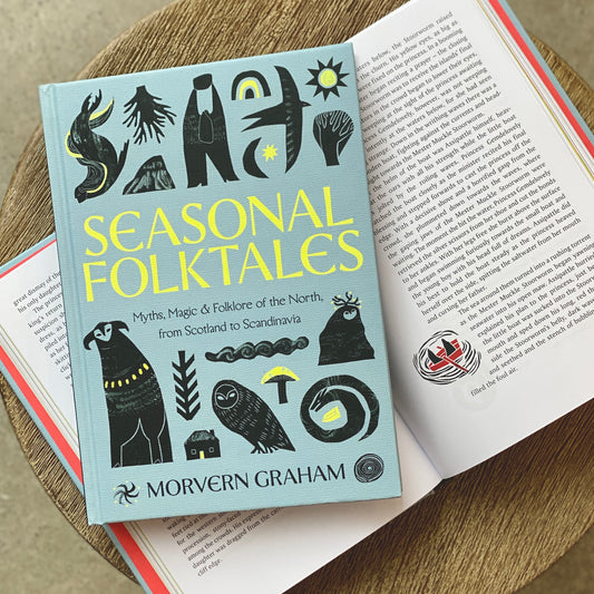 'Seasonal Folktales' book lying on top of an opened copy.