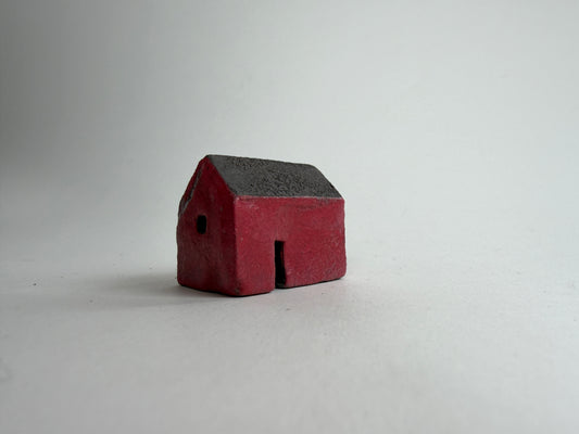 ceramic house on neutral background