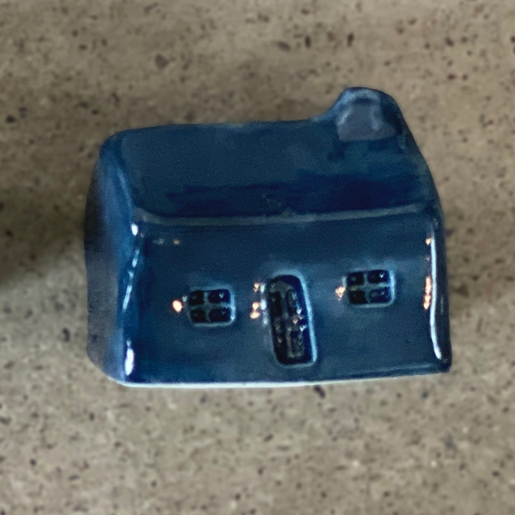 A handmade ceramic bothy with a dark Slate Blue glaze.