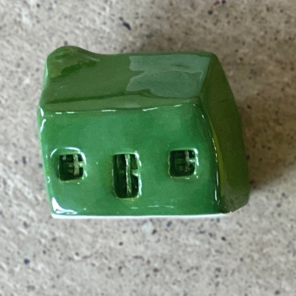 A handmade ceramic bothy with a bright Moss Green glaze.