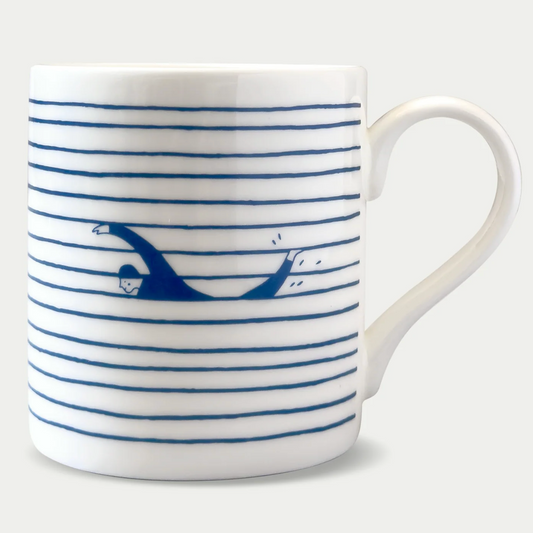 A white fine china mug with a striped design and swimmer illustration in dark blue.
