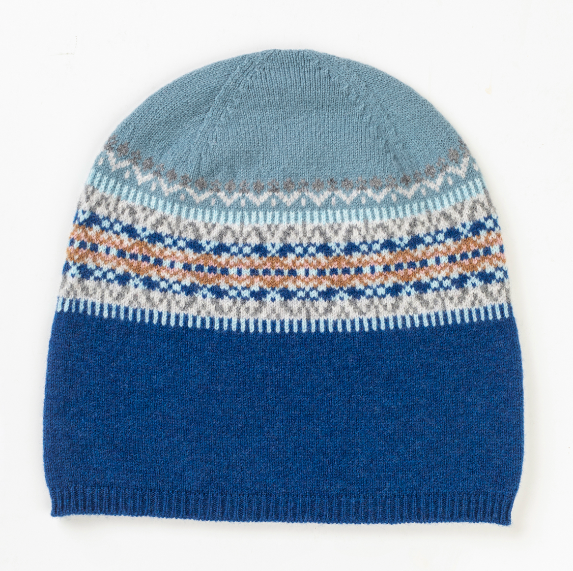 100% wool beanie hat with turn up rib and colour blended Fairisle in shades of blue and grey.  