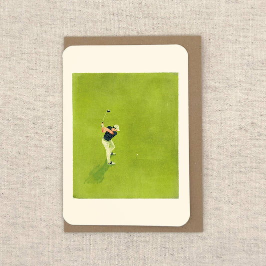 A greeting card with rounded edges and kraft envelope, featuring a colourful illustration of a golfer on a green background.